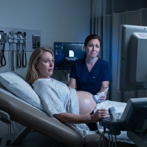 At forty-five, I was pregnant for the first time in my life. During the ultrasound, my doctor’s expression changed. She lowered her voice, asked me to come closer, and stopped me before I could call my husband. Panic hit me instantly. “Is the baby okay?” I asked. She told me the baby looked healthy. Then she turned the screen toward me and showed me something that shattered my marriage in a single breath.